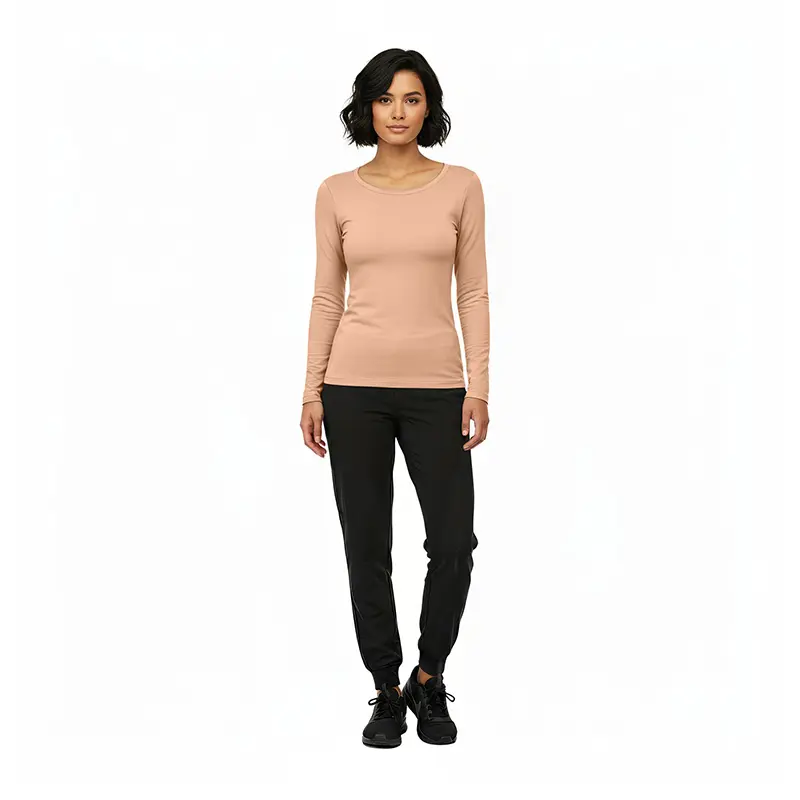 Wholesale women's beige long-sleeve crewneck top paired with black jogger pants and black lace-up shoes