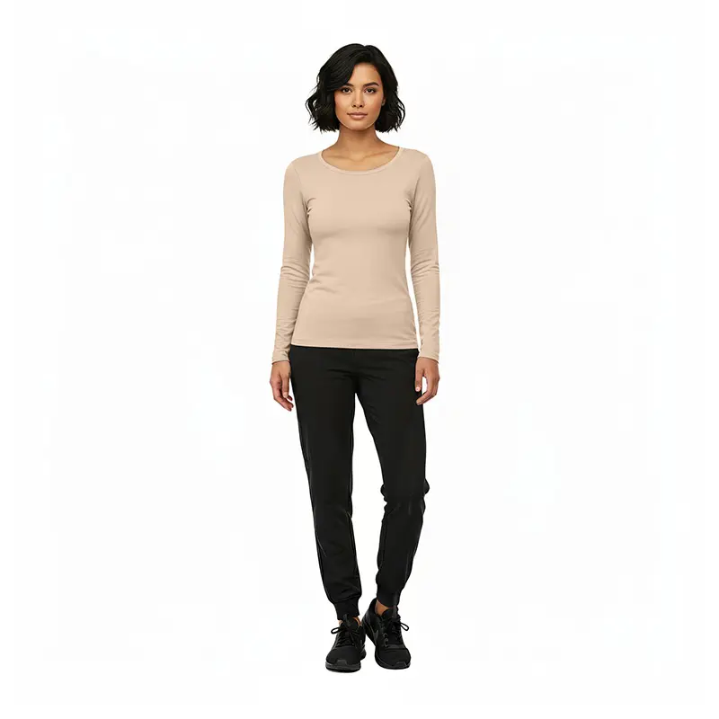 Wholesale women's beige long-sleeve crew neck top paired with black jogger pants and black lace-up shoes