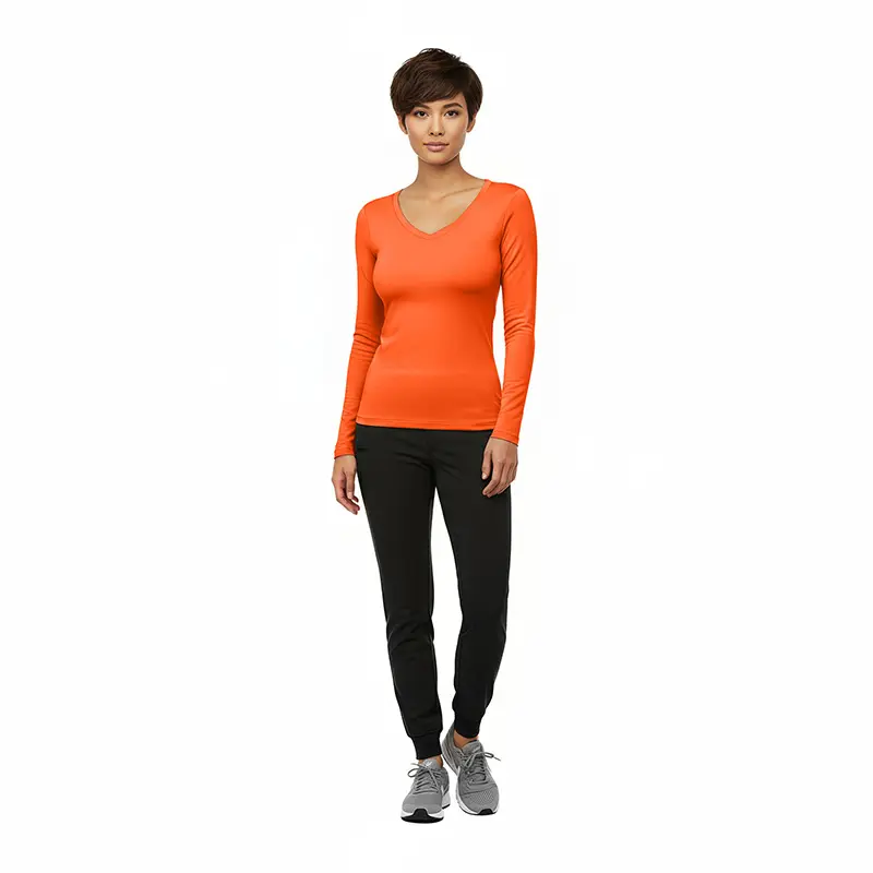 Wholesale women's orange long-sleeve v-neck top with black jogger pants and gray sneakers