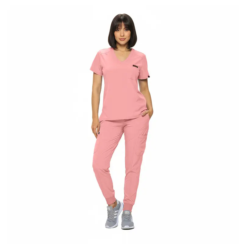 Wholesale women's pink scrub set with v-neck top and jogger pants with pockets