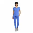 Wholesale women's blue v-neck scrub top with short sleeves and matching jogger pants with gray sneakers