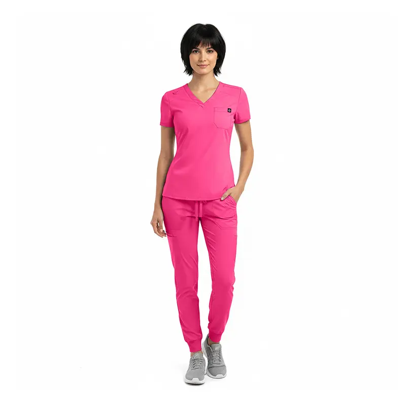 Wholesale women's hot pink v-neck scrub top and jogger pants set with small logo detail