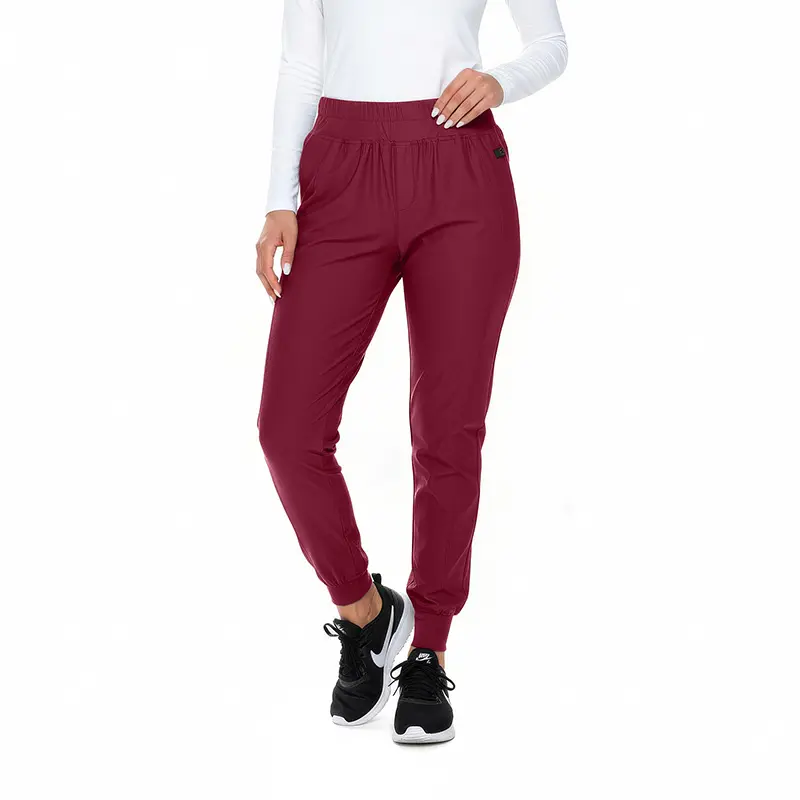 Wholesale women's burgundy jogger pants with elastic waistband and cuffed ankles