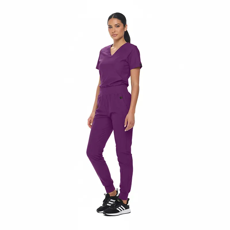 Wholesale women's purple v-neck scrub top and jogger pants set with black sneakers