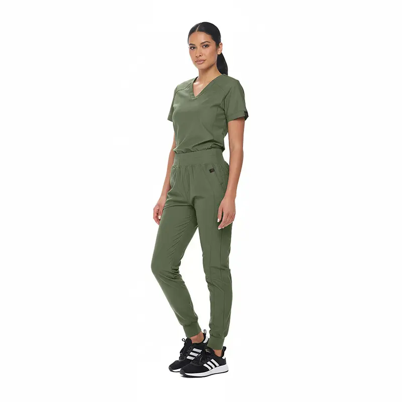 Wholesale women's sage green v-neck scrub top and jogger pants set with black sneakers