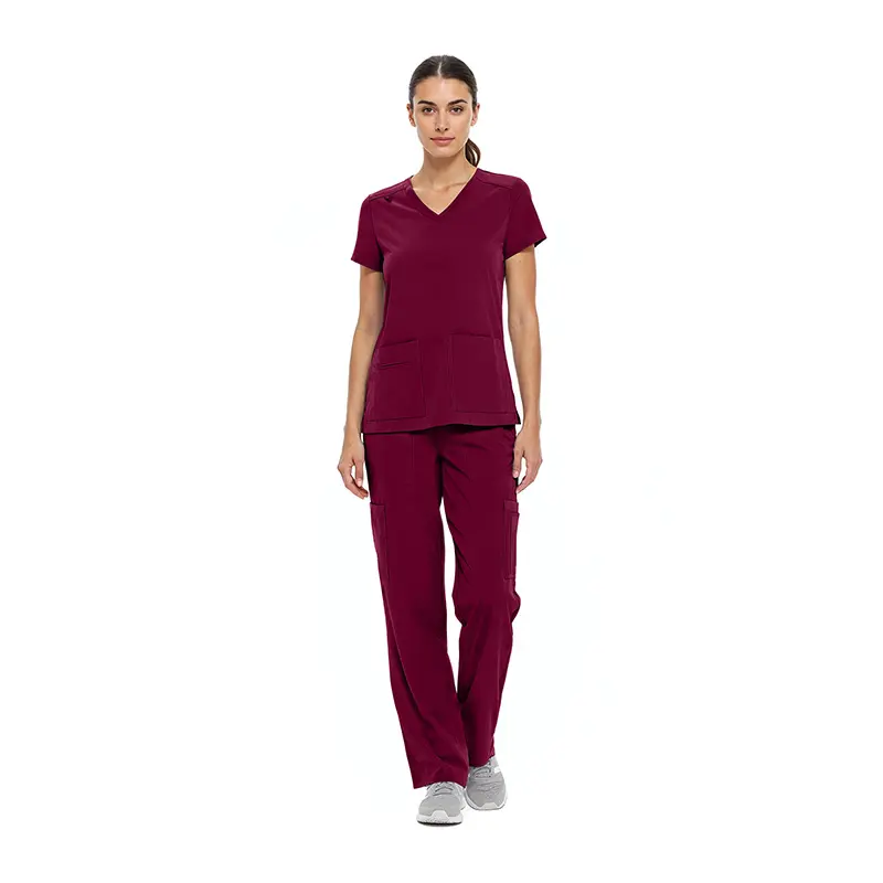 Wholesale women's burgundy scrub set with v-neck top and cargo pants with white sneakers
