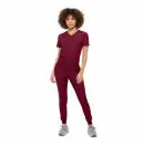 Wholesale women's burgundy v-neck scrub top and jogger pants set with gray sneakers