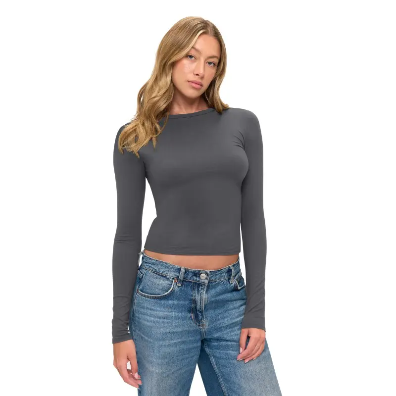 Wholesale women's charcoal long-sleeve cropped fitted top paired with blue denim jeans