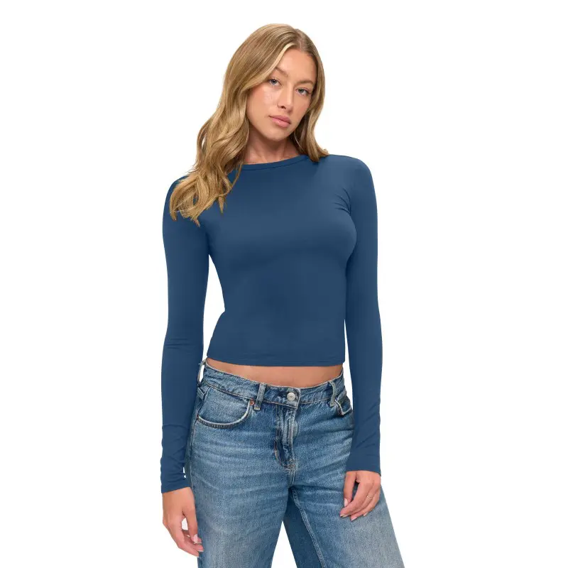 Wholesale women's navy long-sleeve fitted crop top paired with blue denim jeans