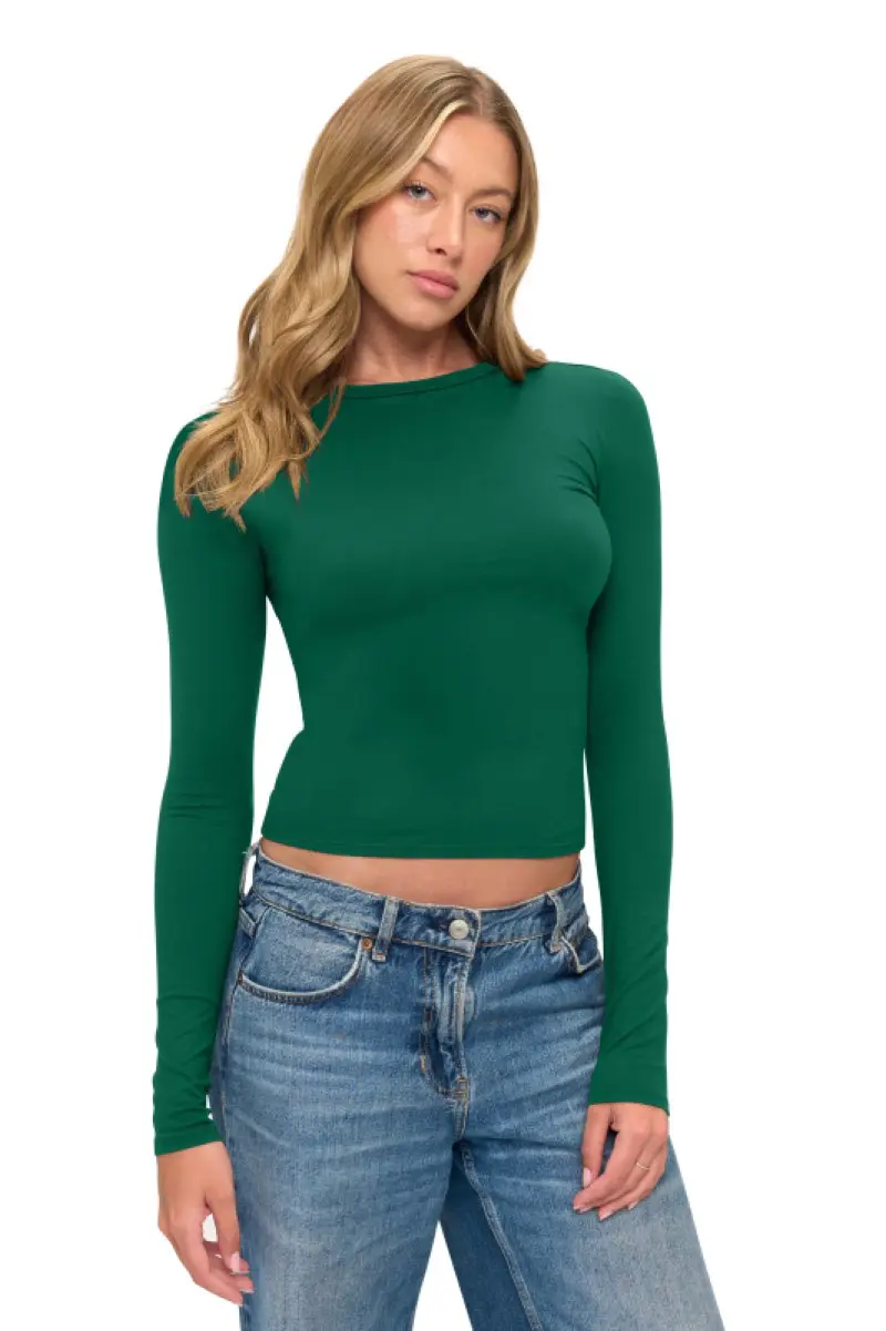 Wholesale women's green long sleeve fitted crop top with crew neckline paired with blue jeans