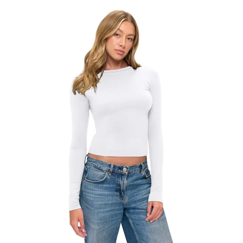 Wholesale white long sleeve cropped ribbed top paired with blue denim jeans