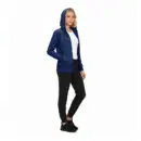 Wholesale women's navy zip-up hoodie with white undershirt, black pants, and black sneakers