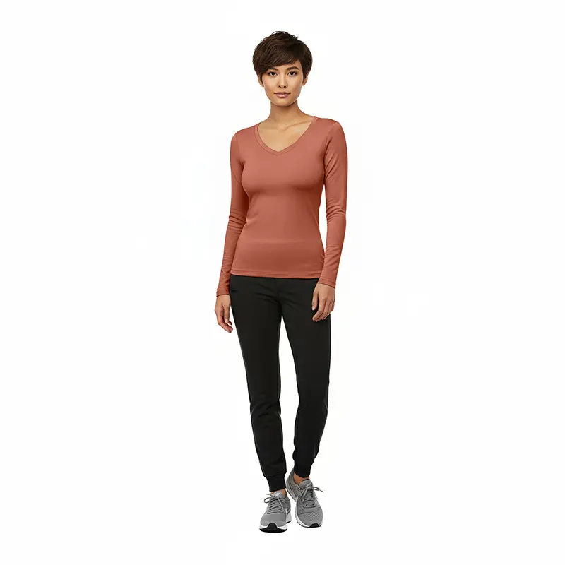 Wholesale women's rust v-neck long-sleeve top with black jogger pants and gray sneakers
