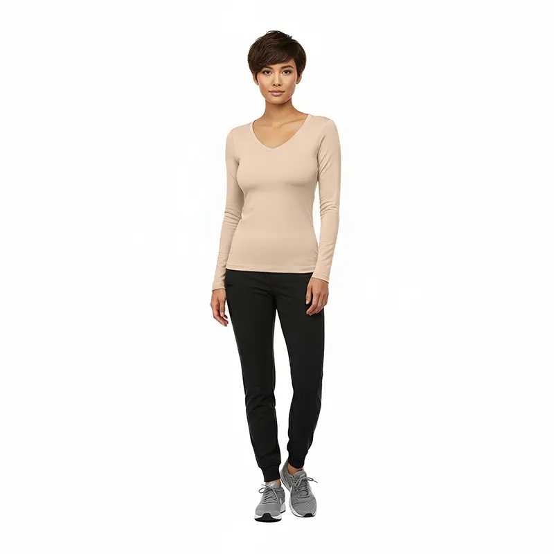 Wholesale women's beige long-sleeve v-neck top with black jogger pants and gray sneakers