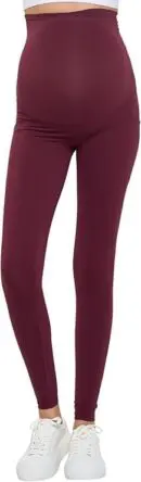 Wholesale burgundy maternity leggings with high waistband and ankle length, paired with white sneakers