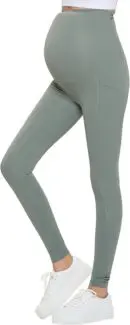 Wholesale sage green maternity leggings with pockets and high waist support paired with white sneakers